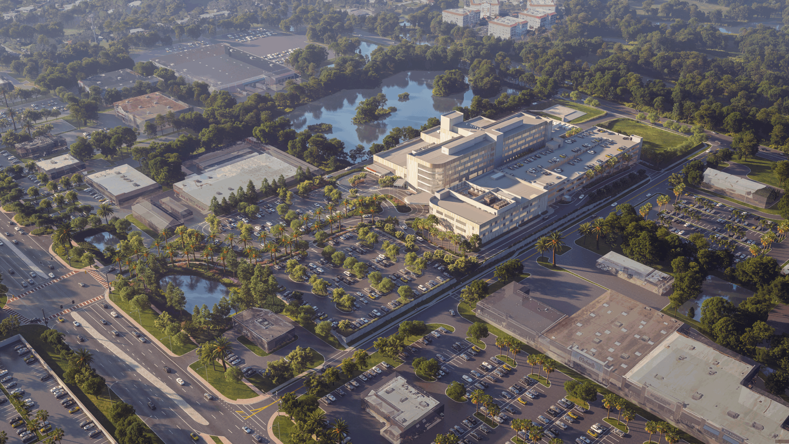 Birds eye view of a lush property and hospital building in the center of it.