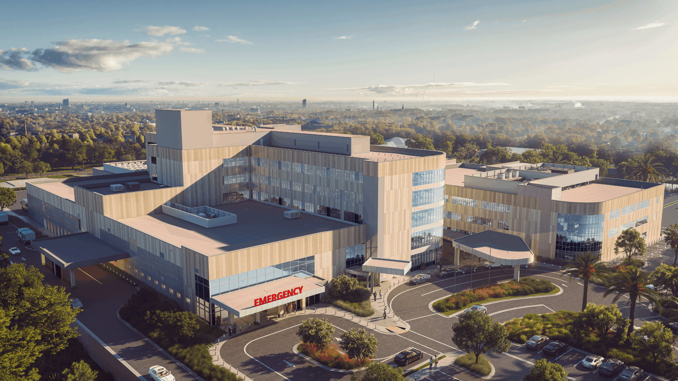 Birds eye view of a hospital building with an 'EMERGENCY' sign visible on the left side of the building entrance.