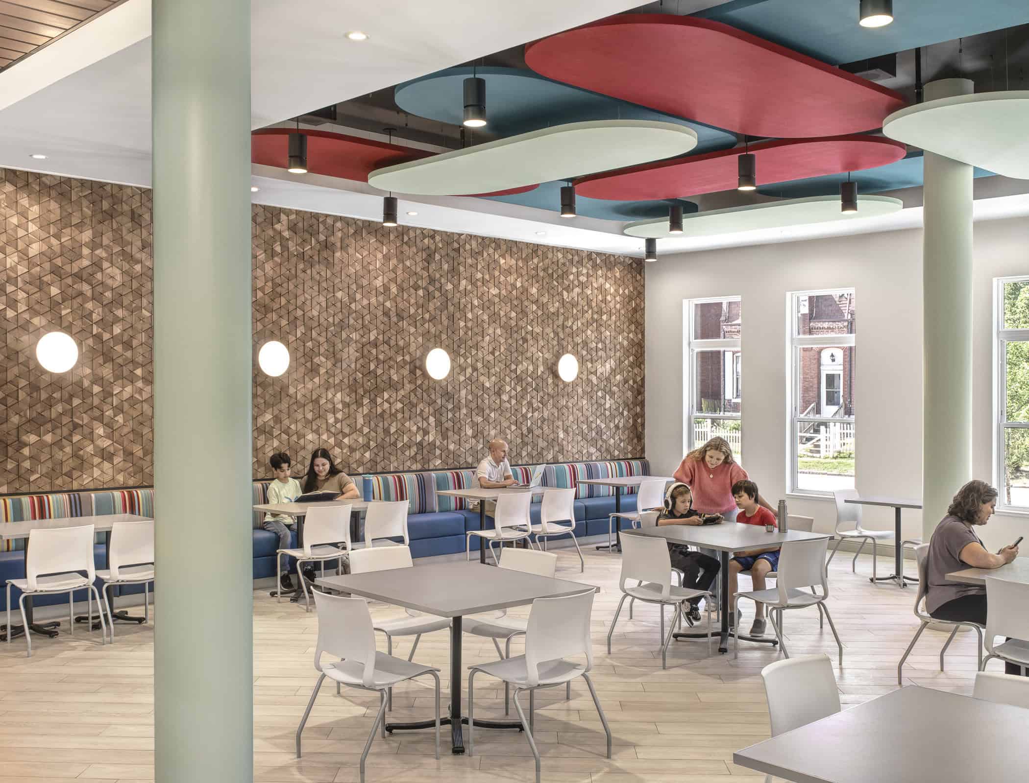 People sitting in the indoor dining area at Ronald McDonald House