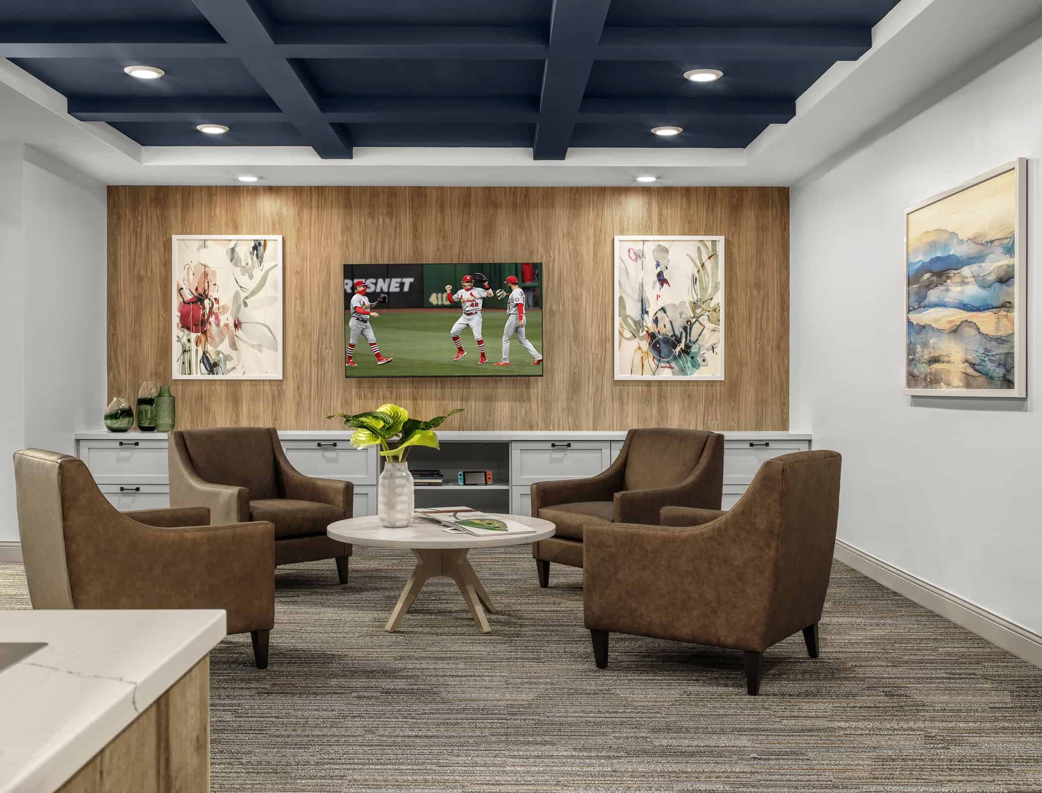 Entertainment area with TV and lounge chairs at Ronald McDonald House