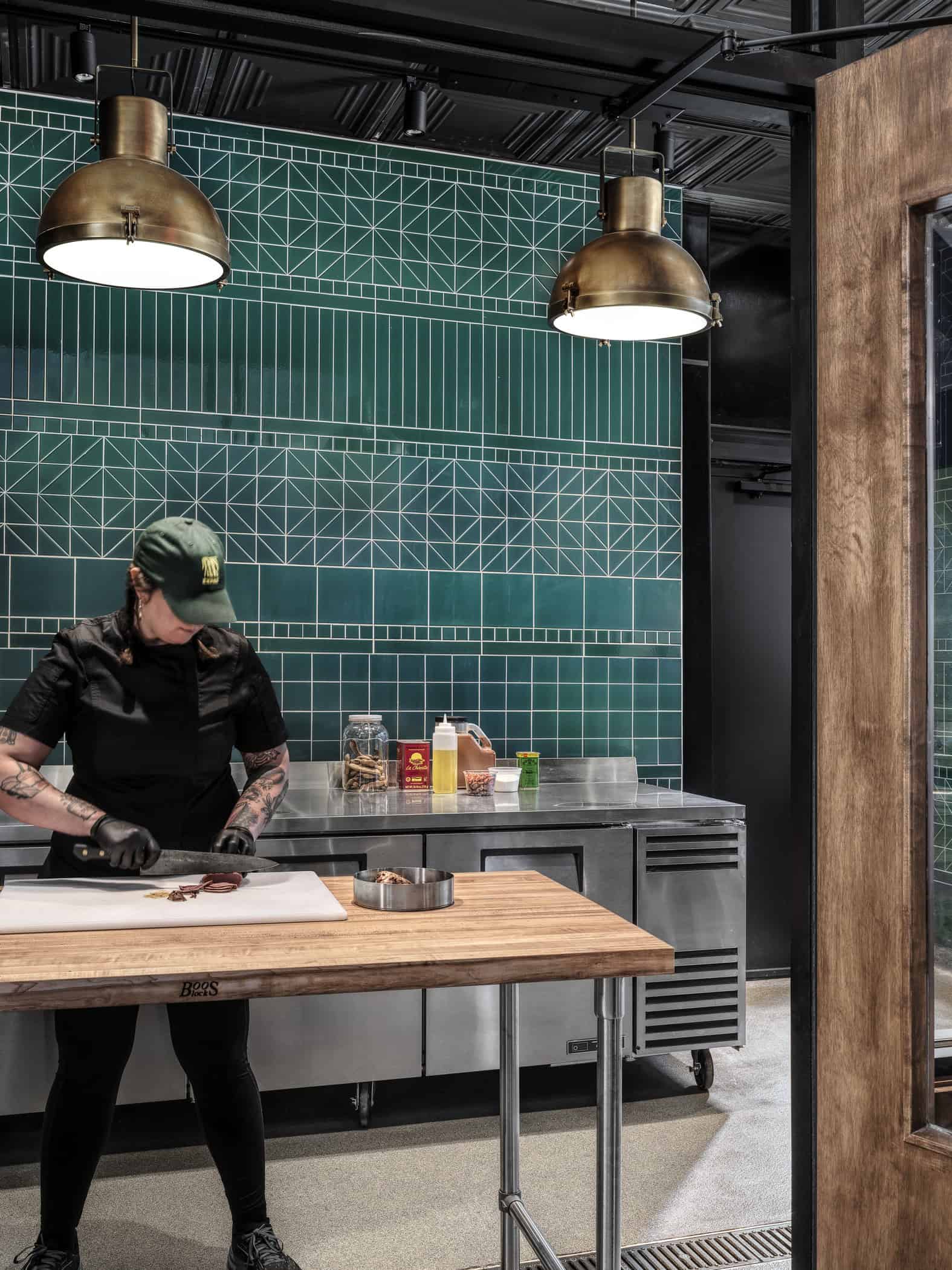 Chef cutting meat at Expat BBQ butchery