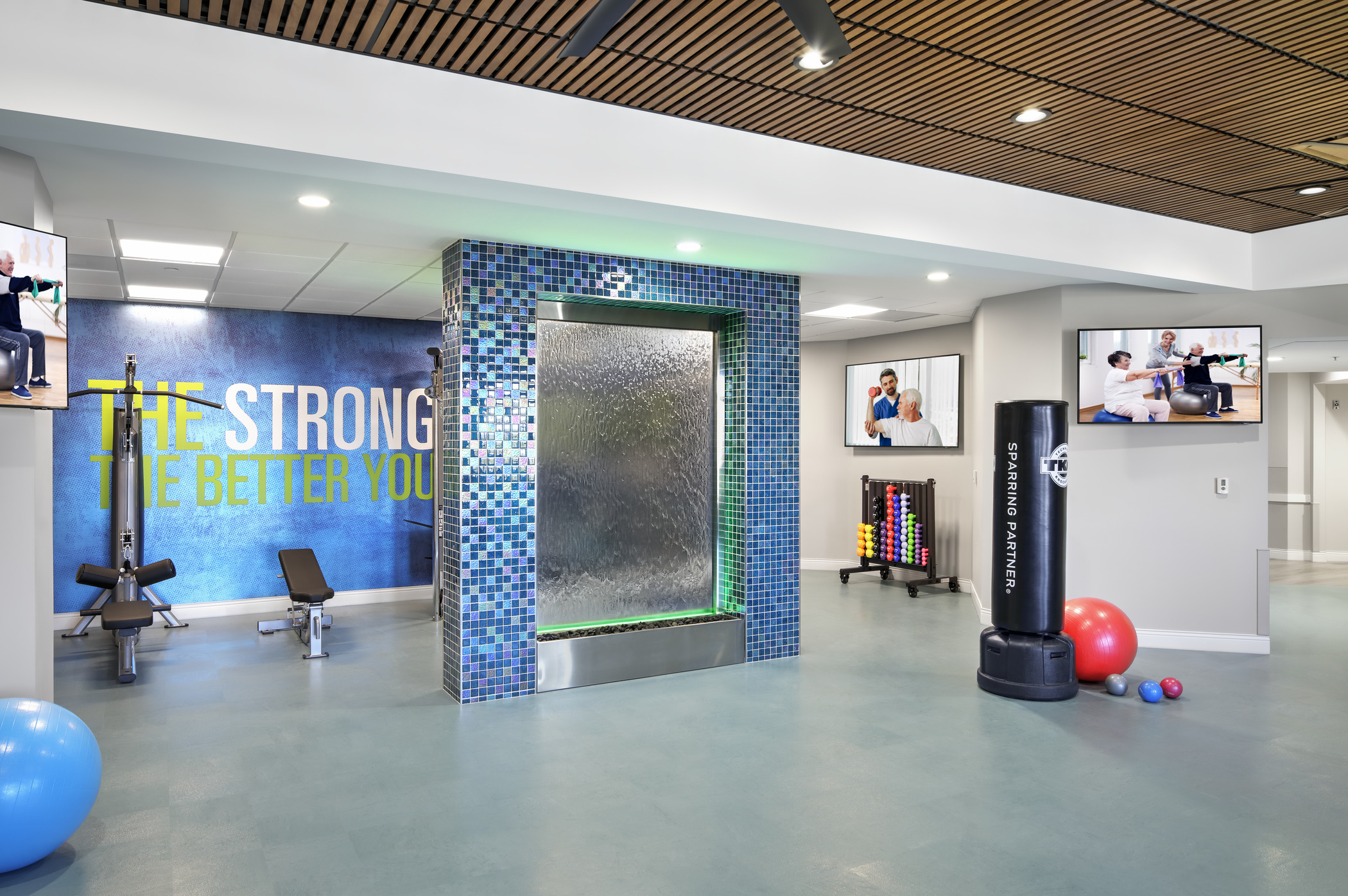 A senior living gym which includes specialized equipment for residents