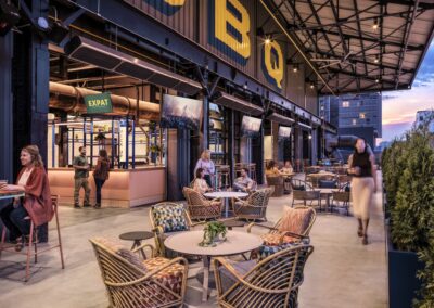 An image of an outdoor patio at a BBQ restaurant with a table and 4 chairs in the foreground
