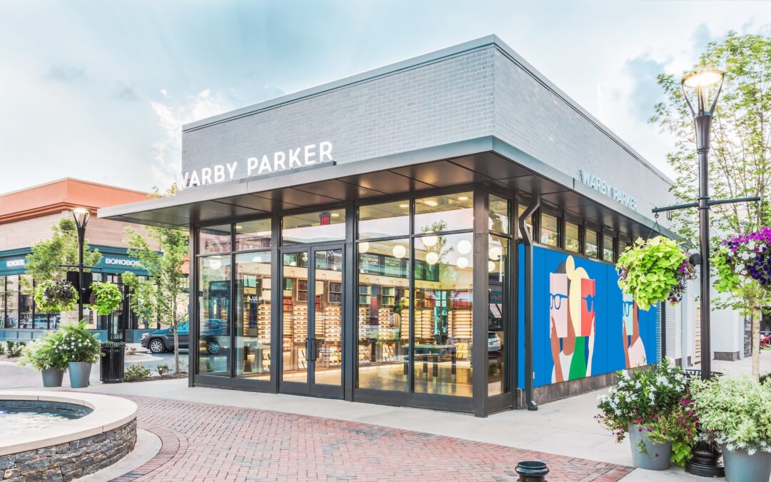 An realistic colorized illustration of a Warby Parker store shown from the outside