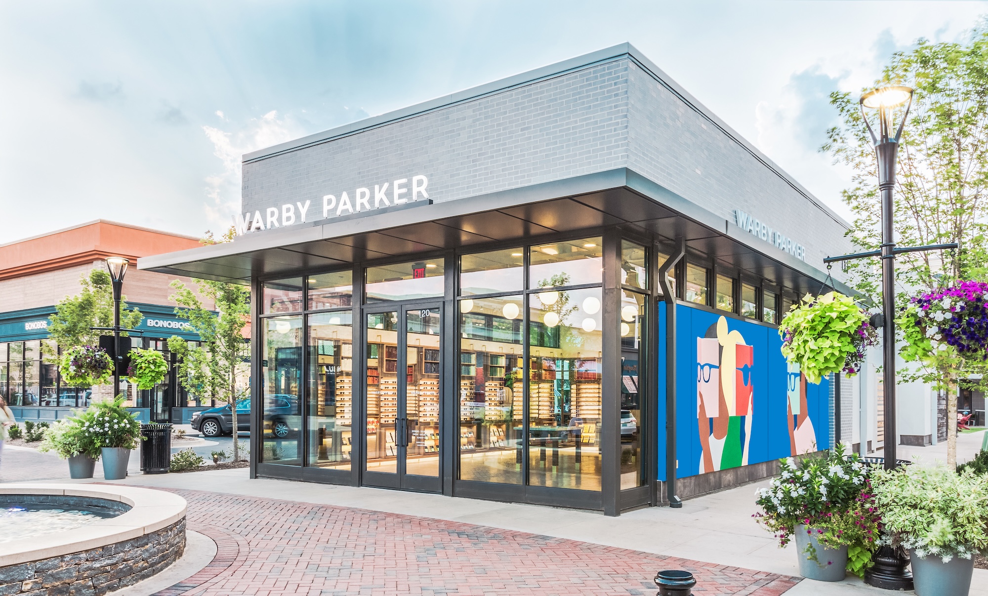 An realistic colorized illustration of a Warby Parker store shown from the outside