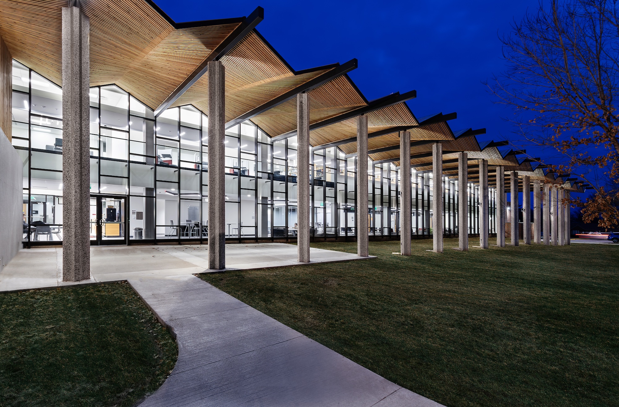 a closer up photo of hte entrance into a public building showing the awning and glass front