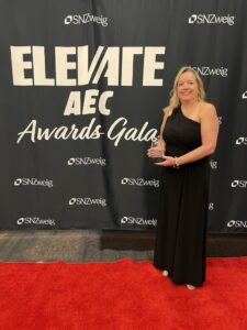 Laura Conrad holds her 2026 Financial Leadership Award
